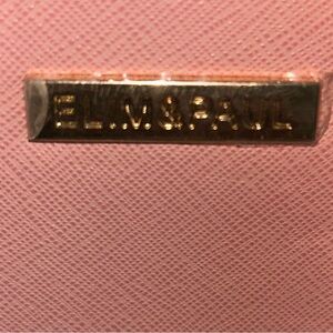 Beautiful purse with wallet and clutch new also has dust bag included.